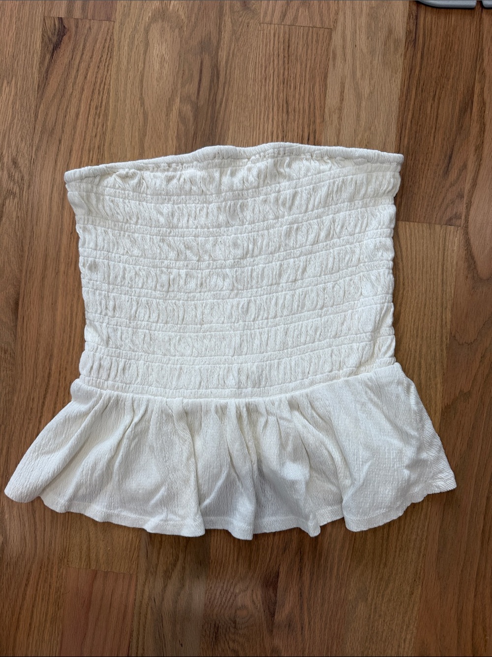 Anthropologie Ivory Smocked Strapless Peplum Top